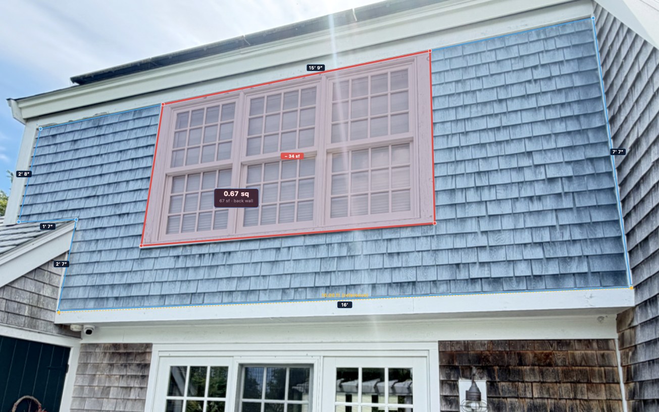 Measuring a siding wall area from a photo — 16 ft base, 15 ft 9 in top, a 34 sq ft window subtracted, 67 sq ft back wall